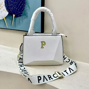 White pebbled leather tote bag with gold P hardware and wide letter-printed strap