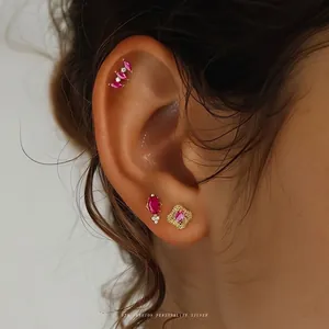 S925 sterling silver gold-plated stud earrings set with ruby-colored heart zircons