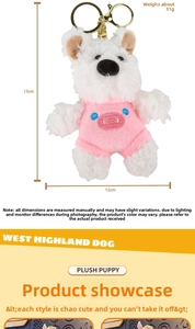 Detail of Westie plush keychain with pink pig costume and golden metal ring