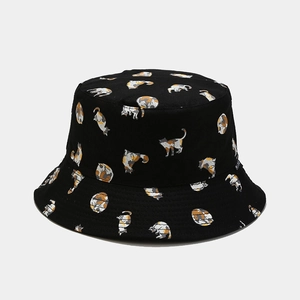 Detailed view of the cute calico cat pattern printed on the black fisherman bucket hat