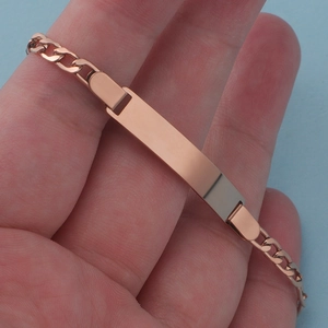 Customizable rose gold stainless steel ID bracelet with a polished engravable bar for kids