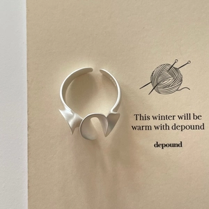 Close-up of S925 sterling silver ring with irregular folding and matte finish details
