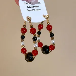 Retro multi-colored beaded hoop earrings with tiger eye and pearl in vintage style