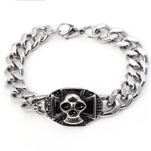Close-up of mens skull and cross Cuban link bracelet with vintage silver finish