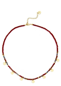 Detail of colorful stone beaded necklace with gold circular charms and stainless steel clasp