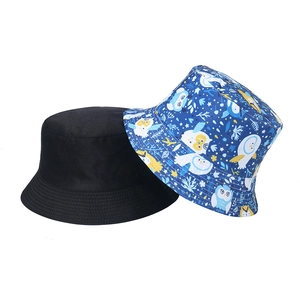 Detailed comparison of black cotton sun hat and blue bucket hat with owl patterns