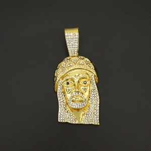 Macro shot of hip hop pendant with gold finish and iced out crystal rhinestones