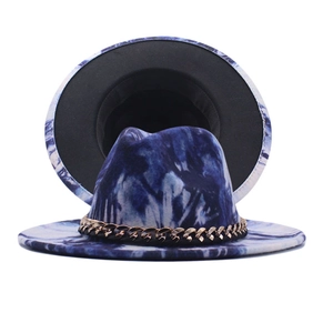 Detail of blue and white tie-dye wool fedora hat featuring a gold metal chain strap