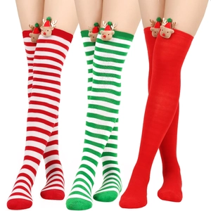 Three pairs of festive striped over-knee socks with cute 3D reindeer doll decorations