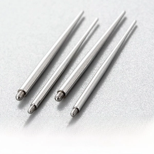 Close-up of four 316 stainless steel externally threaded piercing guide needles in a row