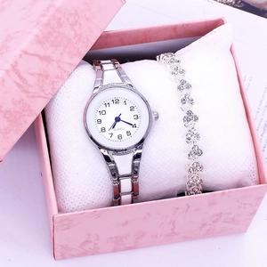 Silver ladies quartz watch with matching heart link bracelet in a pink gift box