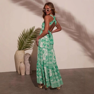 Summer sleeveless green and white print maxi dress with cross back and layered hem