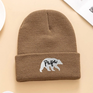 Brown knit beanie hat with embroidered white polar bear and Papa logo in a casual style