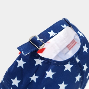 Detail of blue baseball cap back with star print, adjustable strap, and silver metal buckle