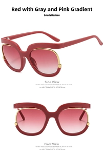 Detailed macro view of dark red resin sunglasses with golden metal inlay and gradient lenses