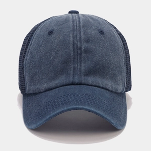 Detail of navy washed cotton baseball cap with breathable mesh and classic curved brim