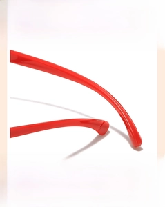 Detail of red curved ergonomic temples with anti-slip design for kids blue light glasses