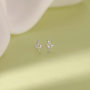 Elegant S999 sterling silver leaf earrings with shimmering cubic zirconia stones