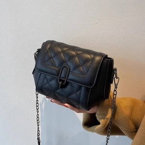 Classic black quilted leather crossbody bag with metal chain strap and U-shaped buckle