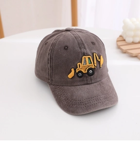 Detailed view of dark grey washed denim kids baseball cap with yellow excavator embroidery