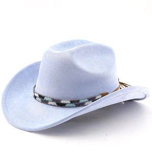 Macro detail of a light blue suede cowboy hat with ethnic beaded band and leather tassels