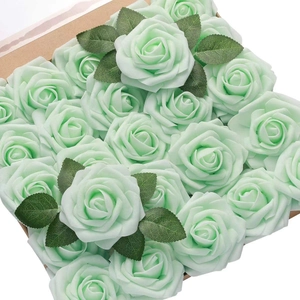 Detailed view of mint green PE foam artificial rose heads with realistic green leaves