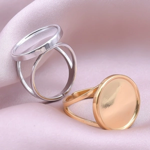 Close-up of gold and silver adjustable round tray ring bases for DIY jewelry making