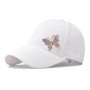 Classic white cotton baseball cap with blue butterfly rhinestone and jacquard texture