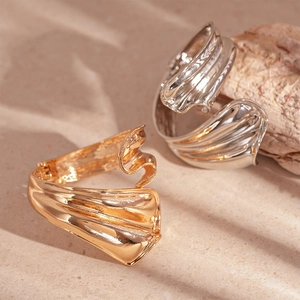 Irregular geometric metal cuff bracelet in gold and silver with elegant pleated texture