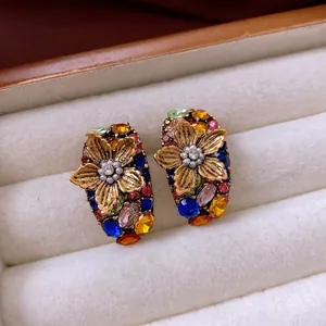 Vintage floral pearl earrings with colorful rhinestones and gold metal flower detail
