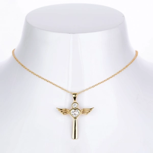 Detail of gold angel pendant necklace with heart-shaped zircon on a neck display