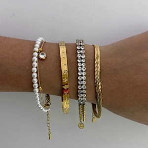 Elegant gold stacked bracelet set with pearls, zircons and star engraving for women