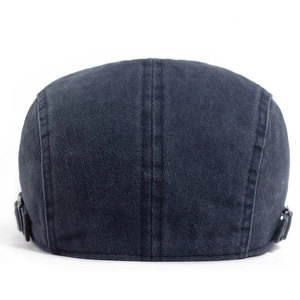 Retro washed navy flat cap featuring five-stripe stitching and metal buckle adjustment