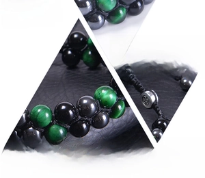 Detail view of triple protection bracelet with tiger eye hematite and black obsidian stones