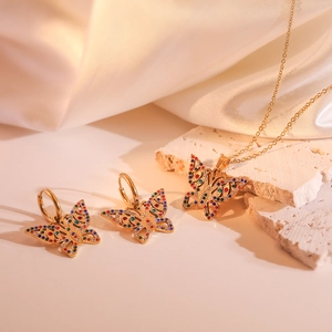 Detail of 18K gold-plated hollow butterfly jewelry set with colorful gemstones