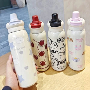 Detail of cute cartoon 316 stainless steel vacuum flasks with multi-color lids on a wooden desk