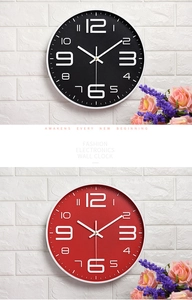Vertical view of modern silent wall clocks in black and red with bold white 3D numbers