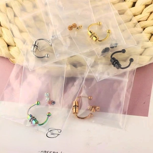 Multiple colorful stainless steel horseshoe nose rings in individual retail packaging