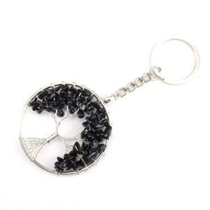 Detailed view of Tree of Life keychain featuring black natural crushed stone and silver wire
