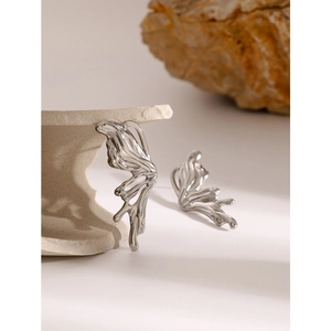 Y2K style fluid metal butterfly studs in silver stainless steel on stone display