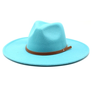 Detailed close-up of sky blue wide brim wool fedora with brown leather band and metal studs