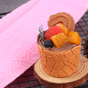 Pink silicone cupcake mold with tree bark texture for DIY baking and chocolate cake decor