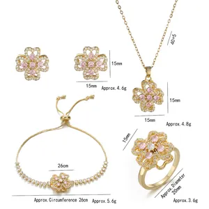 Four-leaf clover jewelry set with pink cubic zirconia in gold plated stainless steel