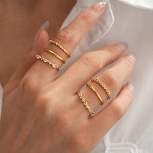 Close-up of 18K gold plated minimalist rings set with marquise cut zircon stones