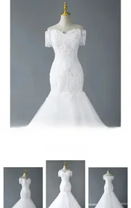 Detail of lace embroidery and sequin beads on a white off-shoulder mermaid wedding dress