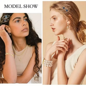 Silver Turkish evil eye hair clip with sparkling rhinestones worn by a fashion model