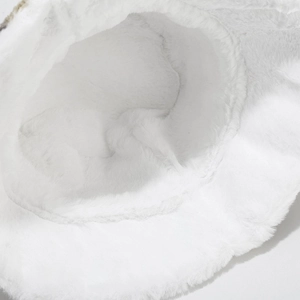 Close-up of soft white plush fabric texture and fluffy fibers of the wavy bucket hat