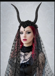 Gothic Halloween headpiece featuring black sheep horns and polka dot mesh veil on a model