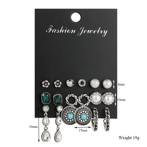 Detail view of 9 pairs of vintage geometric earrings with pearls and size measurements