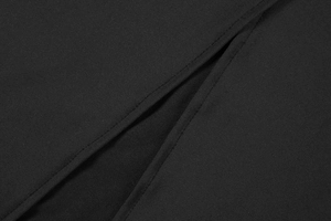 Close-up of the professional stitching and side slit detail on the black elegant dress